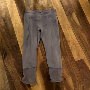 Athleta Girl plum colored leggings. Mesh design at bottom. Size 8-10